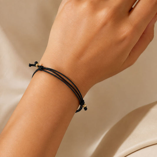 Brățară Aur 14 K cu șnur negru cu infinit și inimioară